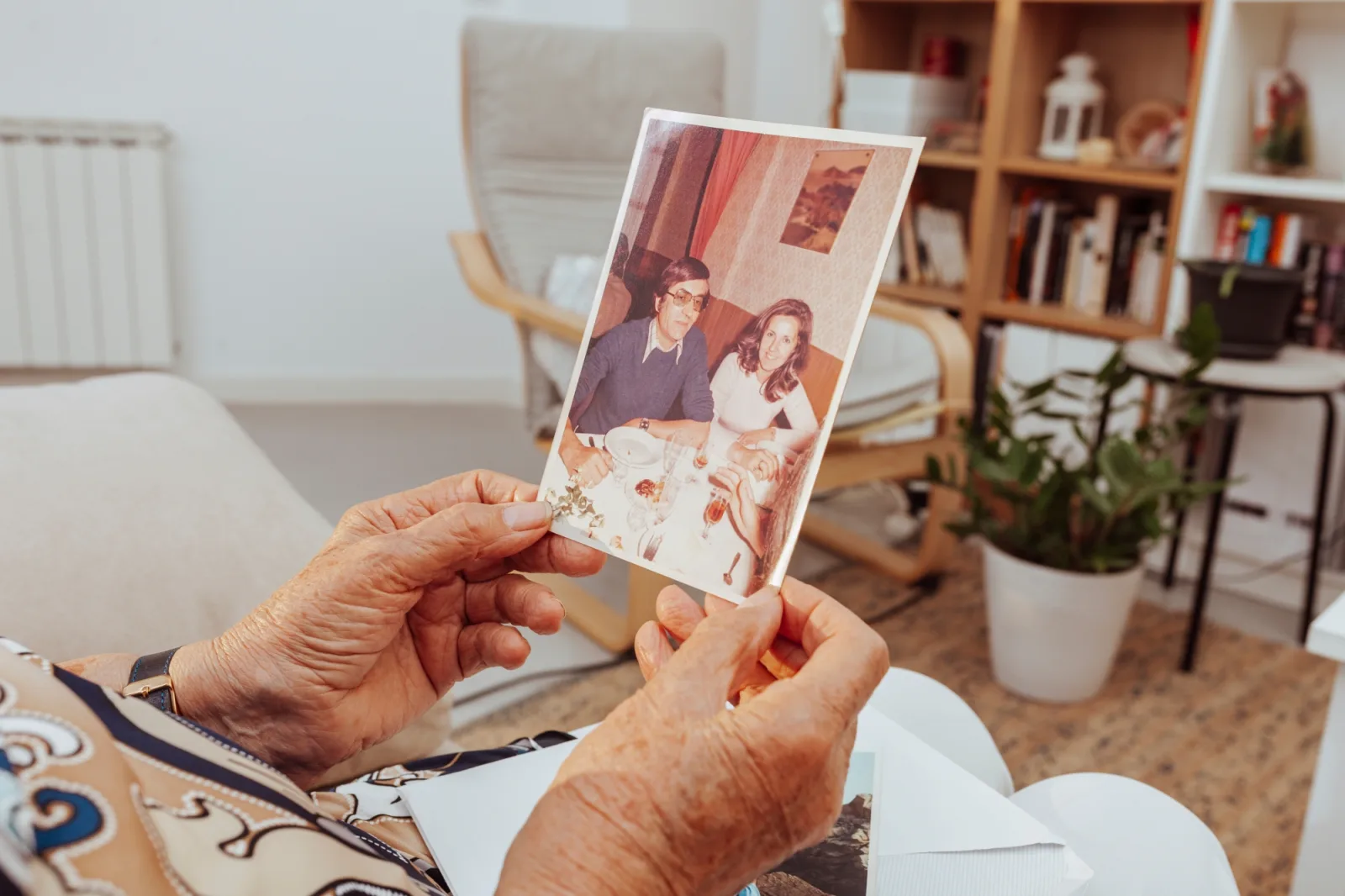 Senior woman looking at old photograph