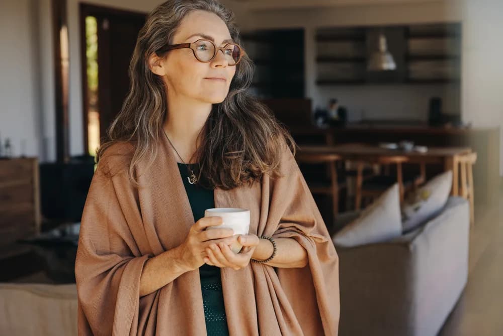 Mature lady holding coffee cup
