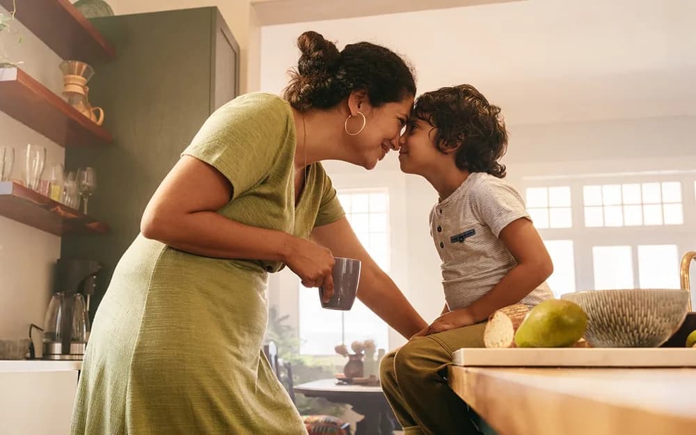 Mother and son cooking together in kitchen