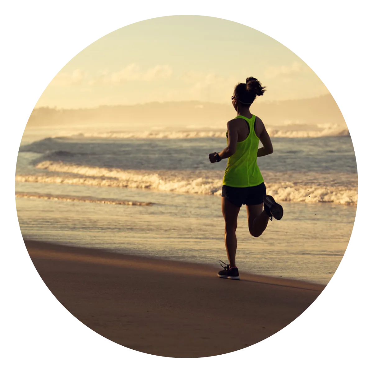 Woman running along the beach