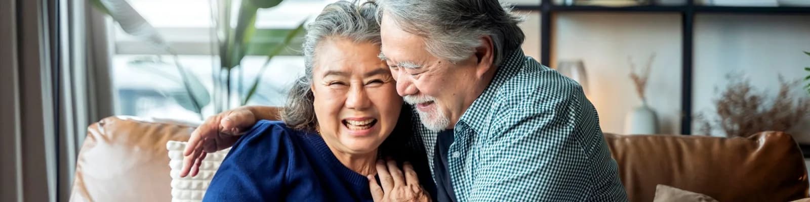 Happy senior couple hugging