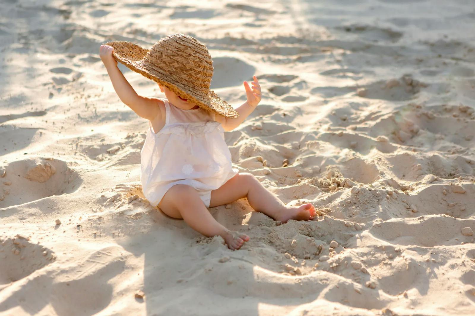 Toddler sitting on the beach