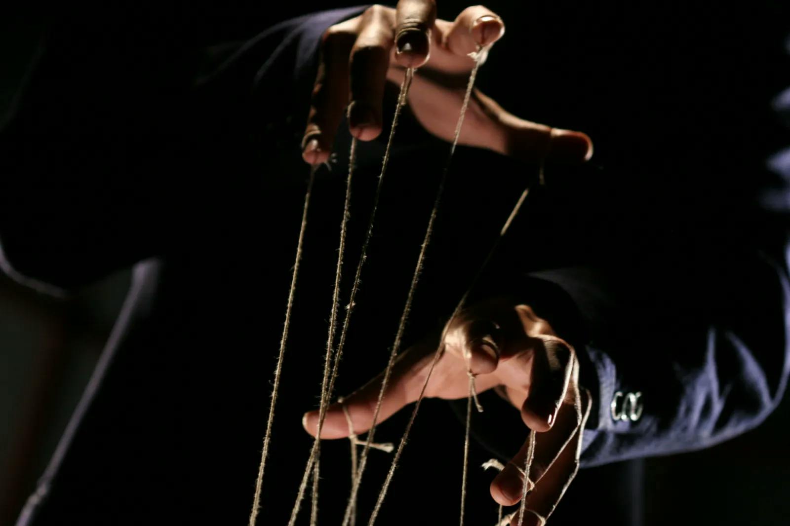 Man with puppet strings